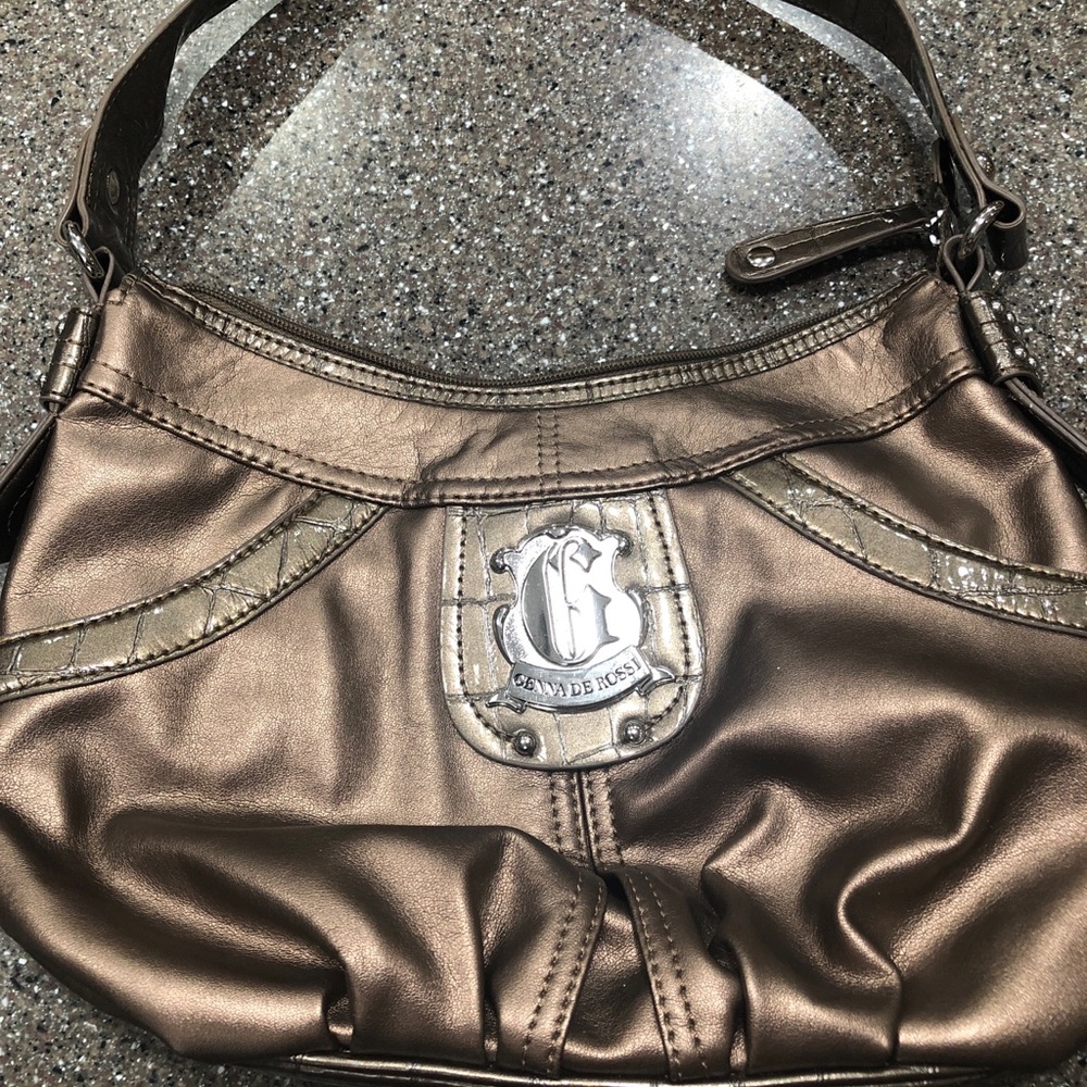This purse was never used.  Bought for daughter   It is bronze in color.